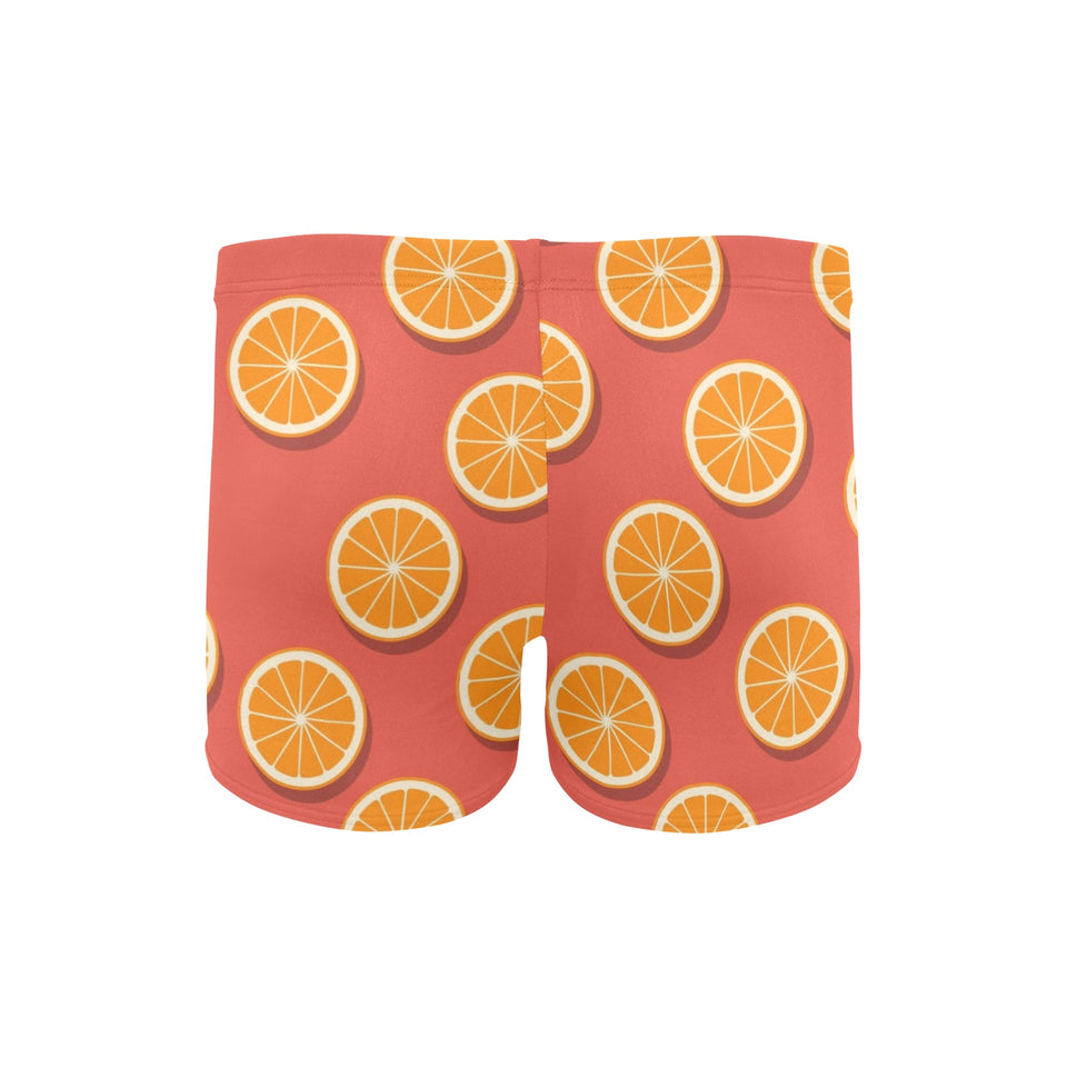 Oranges pattern red background Men's Swimming Trunks