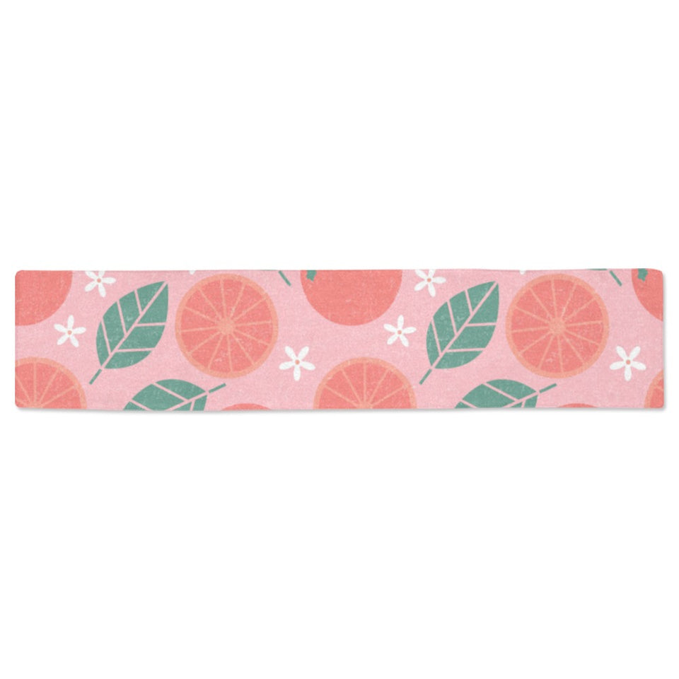 Grapefruit leaves flower pink background Table Runner