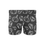 Garlic pattern black background Men's Swimming Trunks