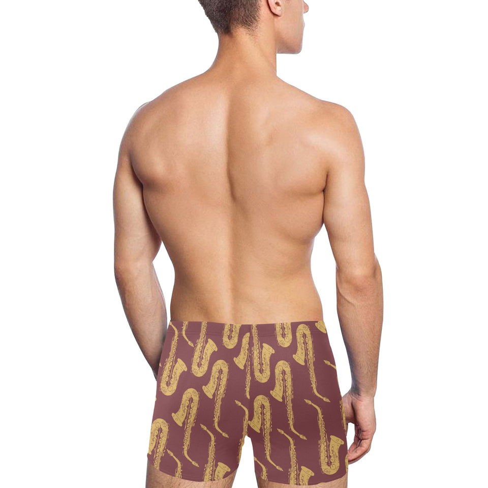 Hand drawn gold saxophone red background Men's Swimming Trunks