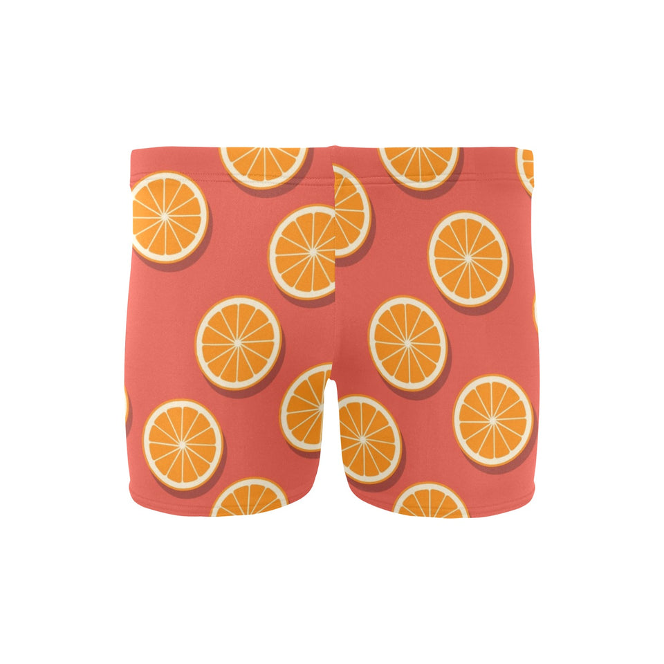 Oranges pattern red background Men's Swimming Trunks