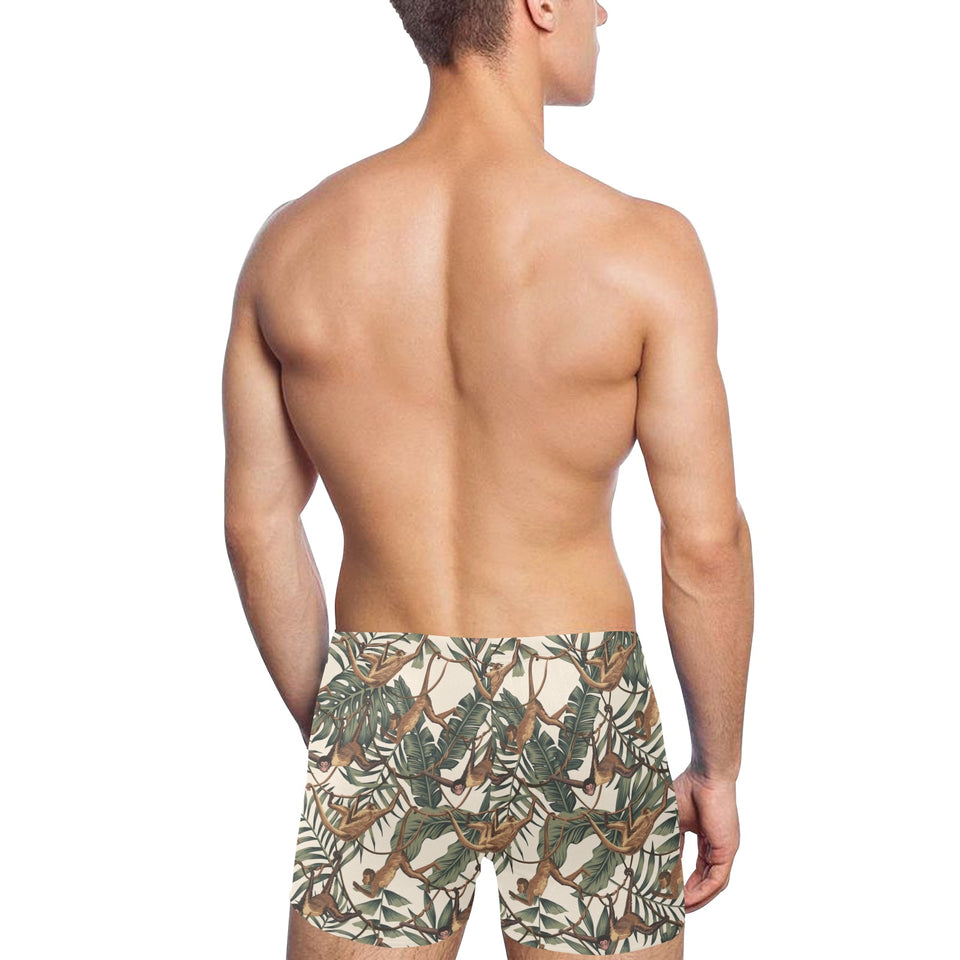 Monkey tropical leaves background Men's Swimming Trunks