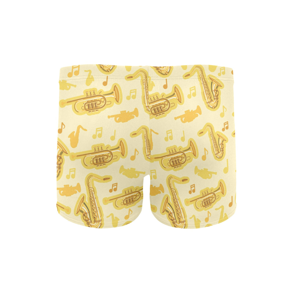 Saxophone cornet pattern yellow background Men's Swimming Trunks