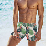 heliconia flowers, palm and monstera leaves Men's Swimming Trunks