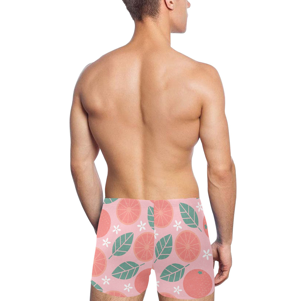 Grapefruit leaves flower pink background Men's Swimming Trunks