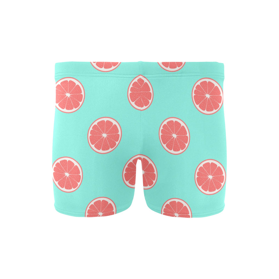 Grapefruit green background Men's Swimming Trunks
