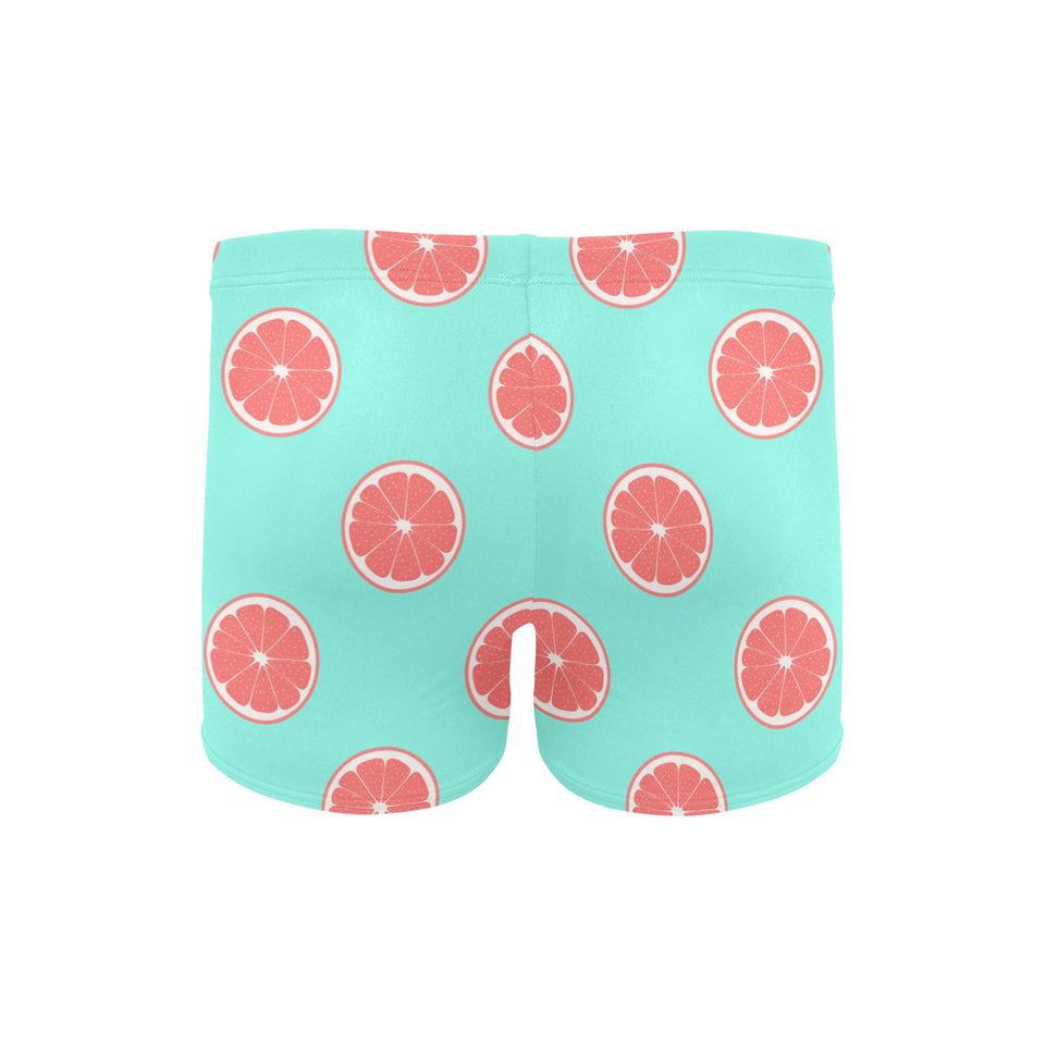 Grapefruit green background Men's Swimming Trunks