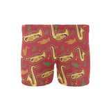 Saxophone cornet pattern red background Men's Swimming Trunks
