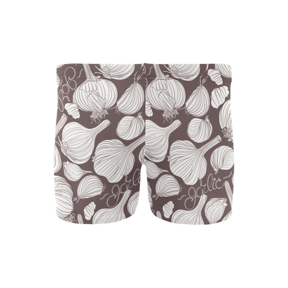Garlic bulb dark background Men's Swimming Trunks