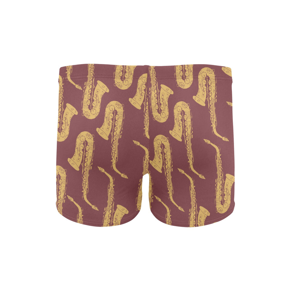 Hand drawn gold saxophone red background Men's Swimming Trunks