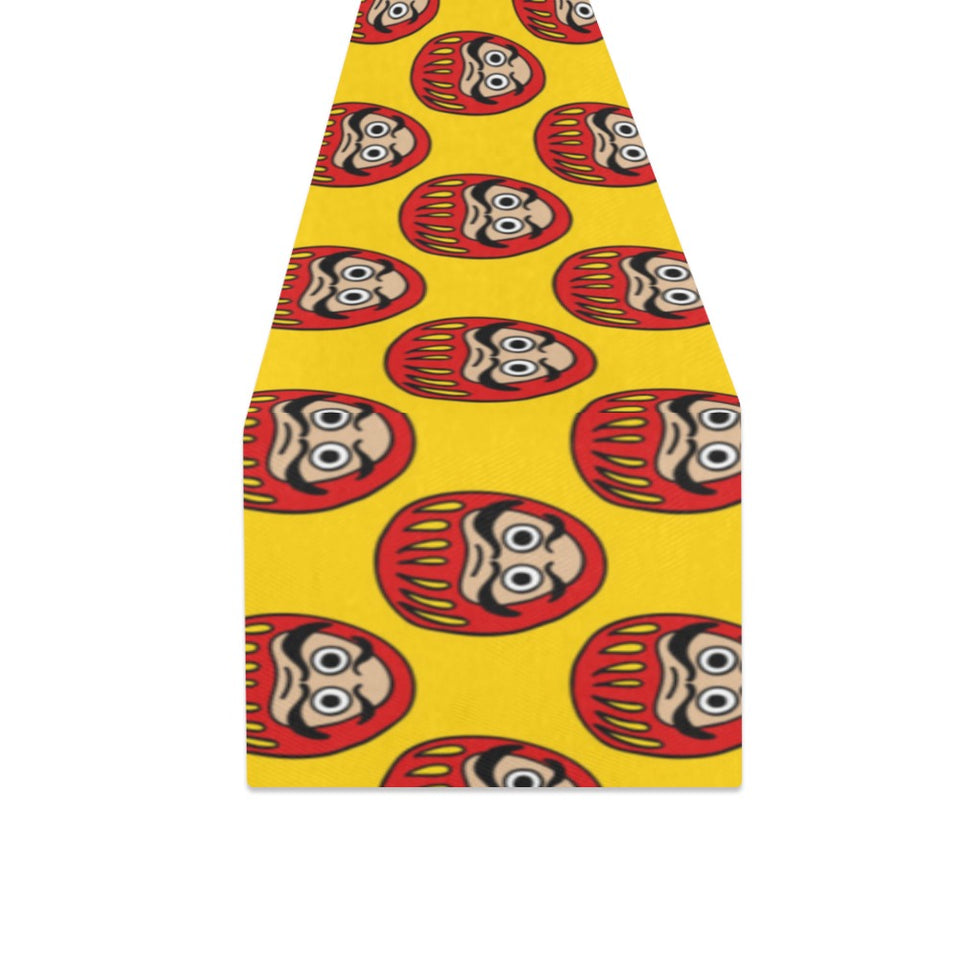 Daruma japanese wooden doll yellow background Table Runner