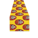 Daruma japanese wooden doll yellow background Table Runner