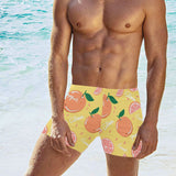 Grapefruit yellow background Men's Swimming Trunks