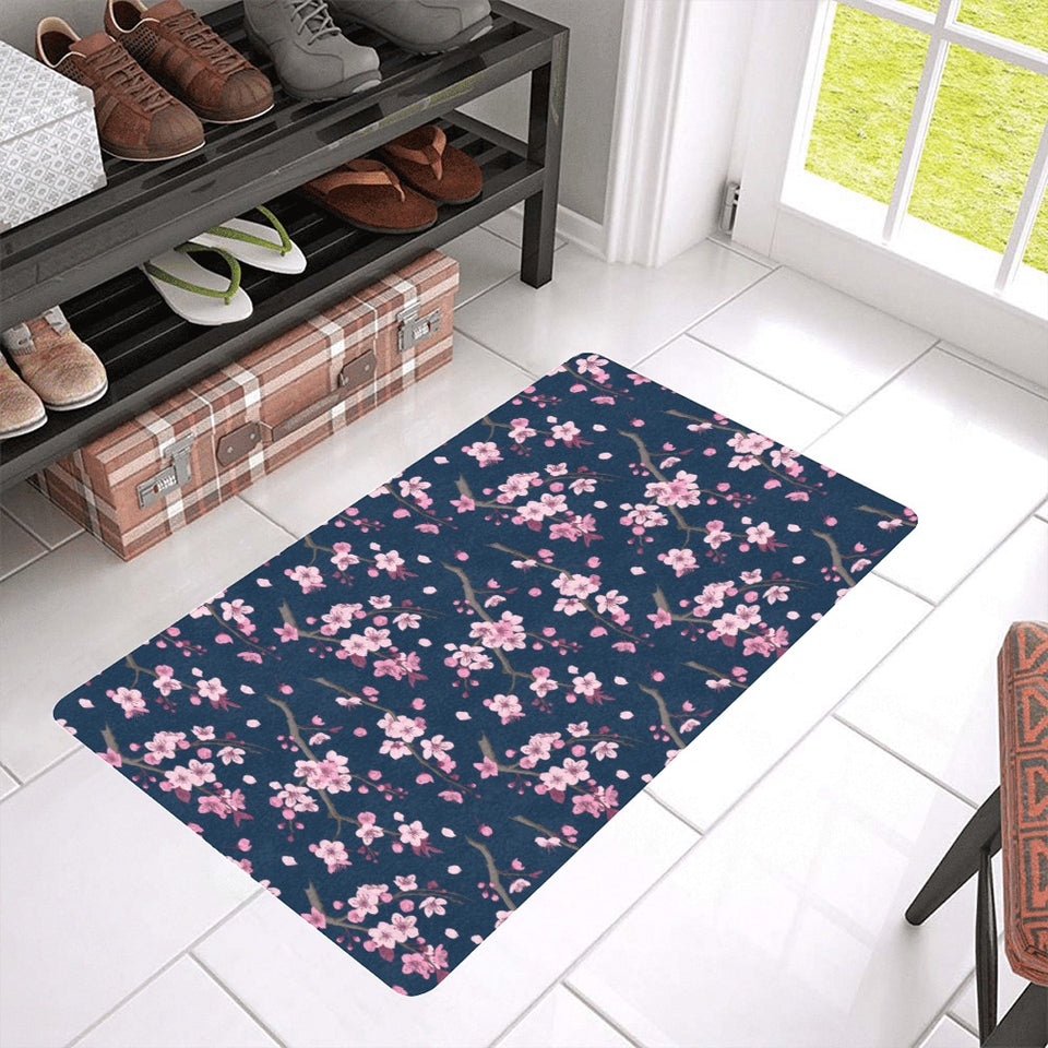 Pink sakura cherry blossom blue background Doormat