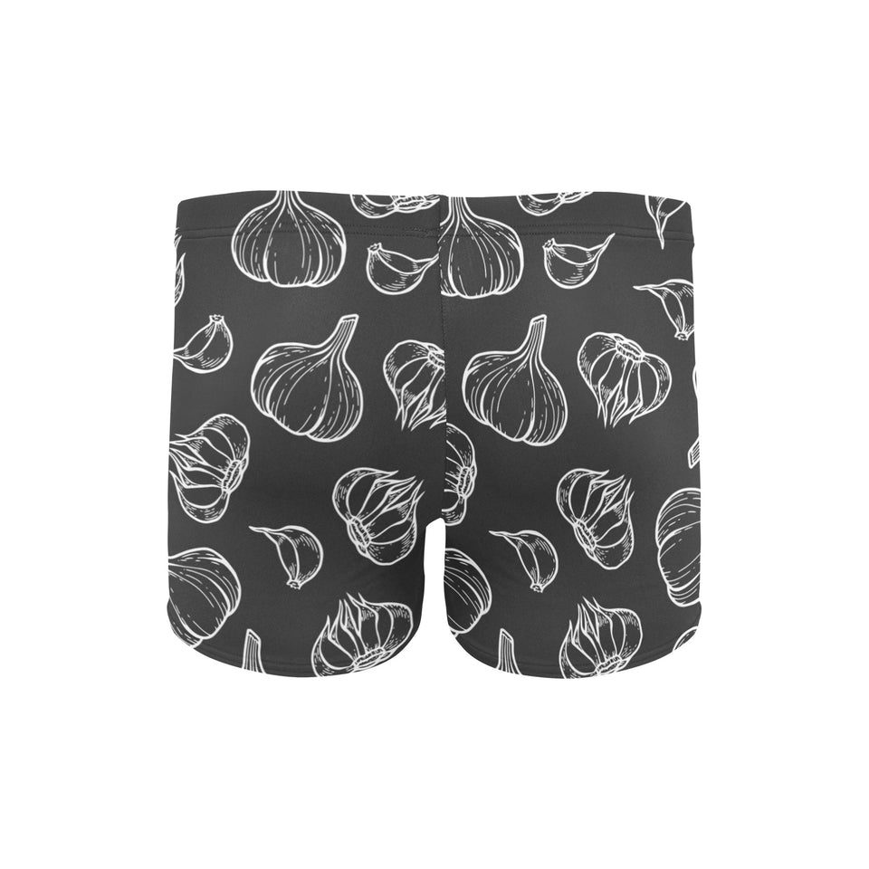 Garlic pattern black background Men's Swimming Trunks