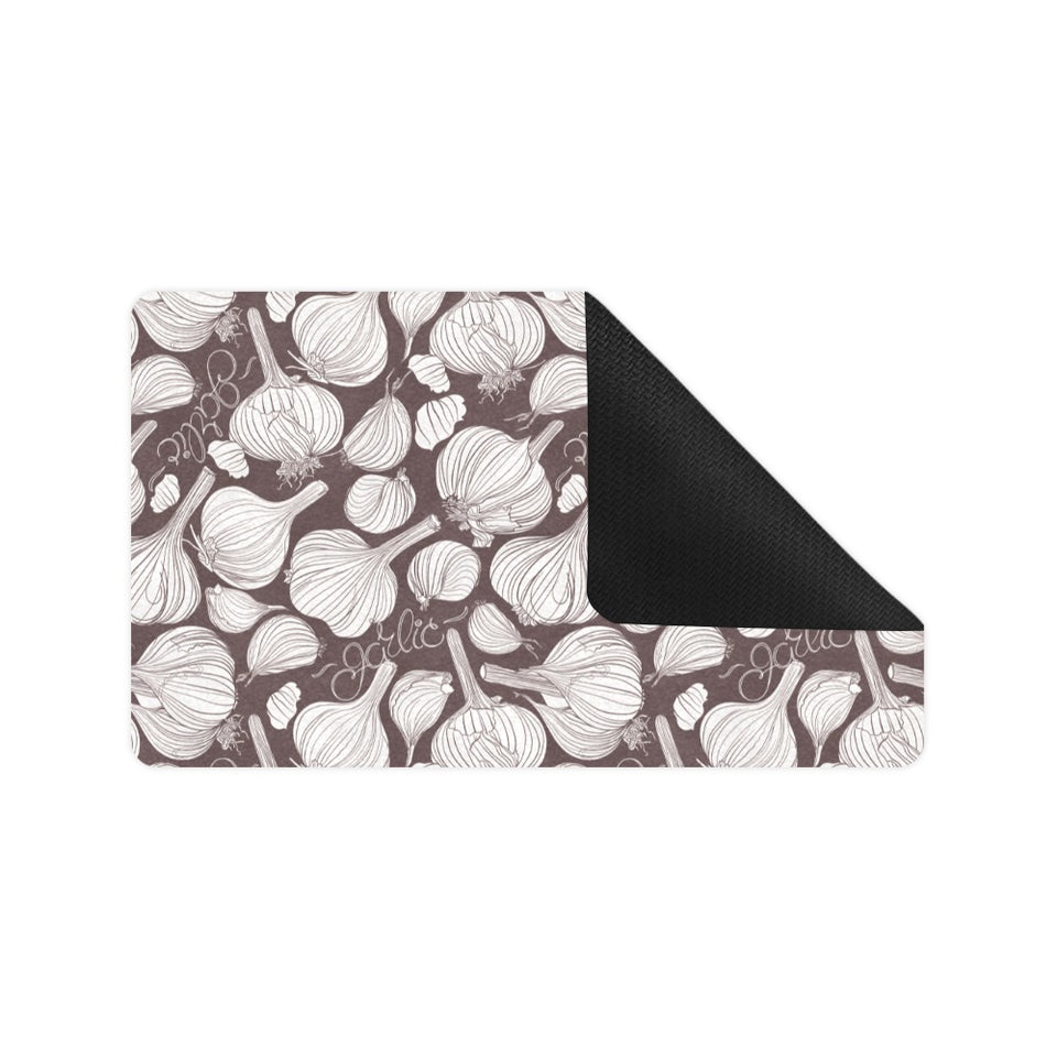Garlic bulb dark background Doormat