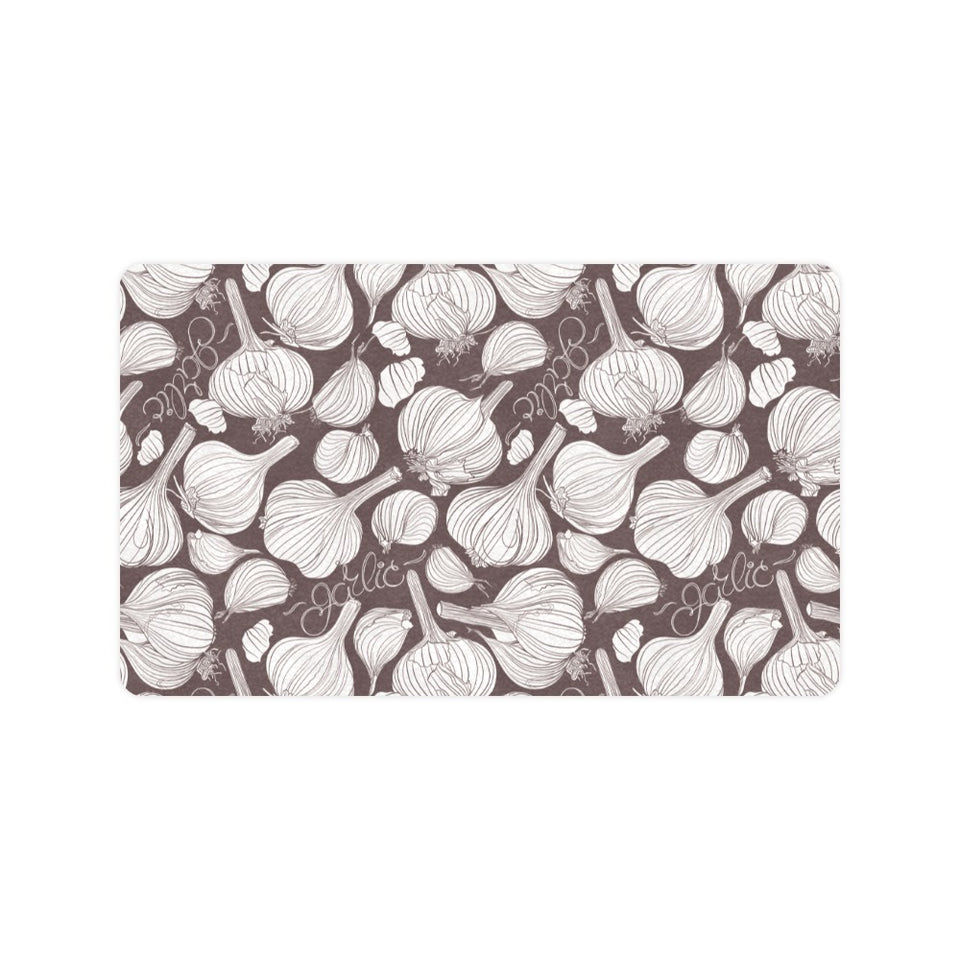 Garlic bulb dark background Doormat