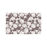 Garlic bulb dark background Doormat