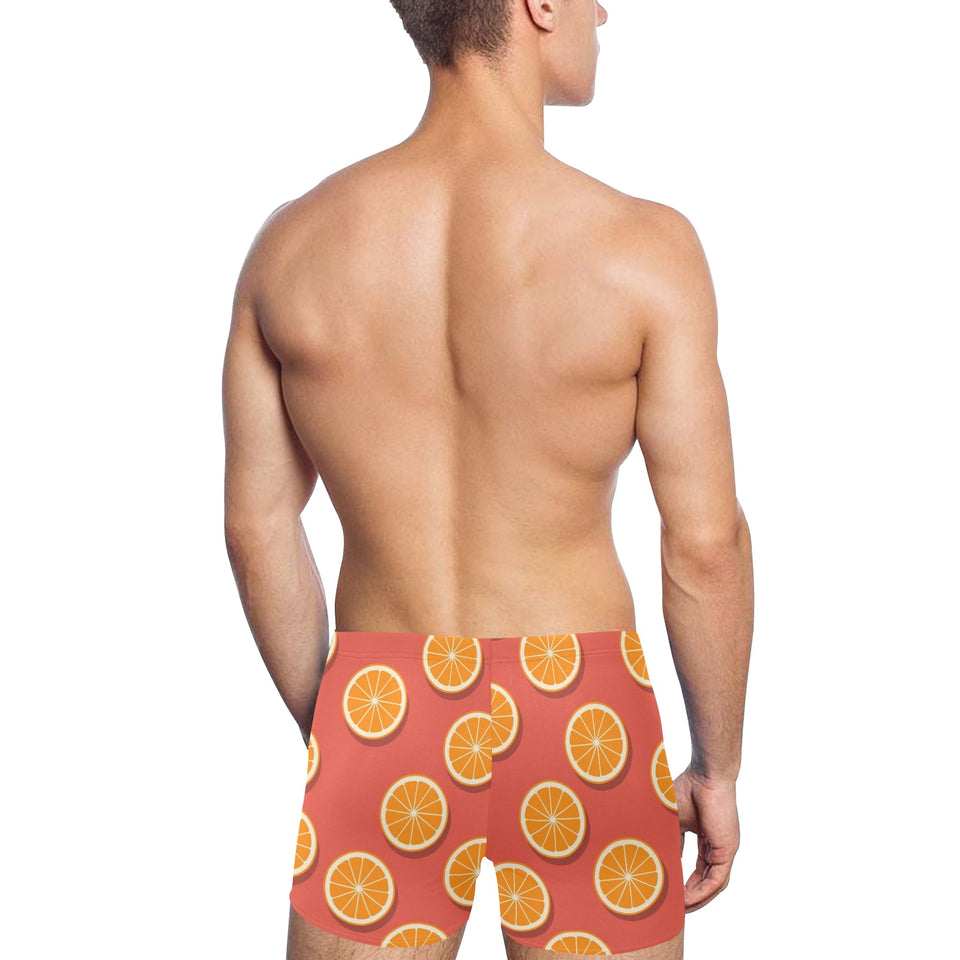 Oranges pattern red background Men's Swimming Trunks