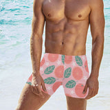 Grapefruit leaves flower pink background Men's Swimming Trunks