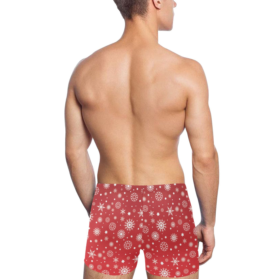 Snowflake pattern red background Men's Swimming Trunks