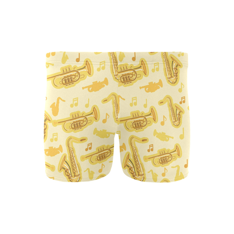 Saxophone cornet pattern yellow background Men's Swimming Trunks