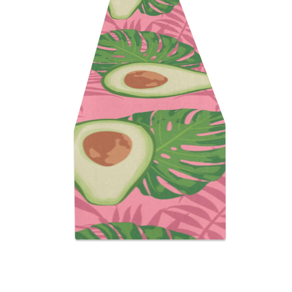 Avocado slices leaves pink back ground Table Runner