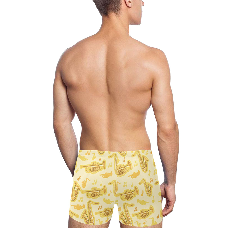 Saxophone cornet pattern yellow background Men's Swimming Trunks