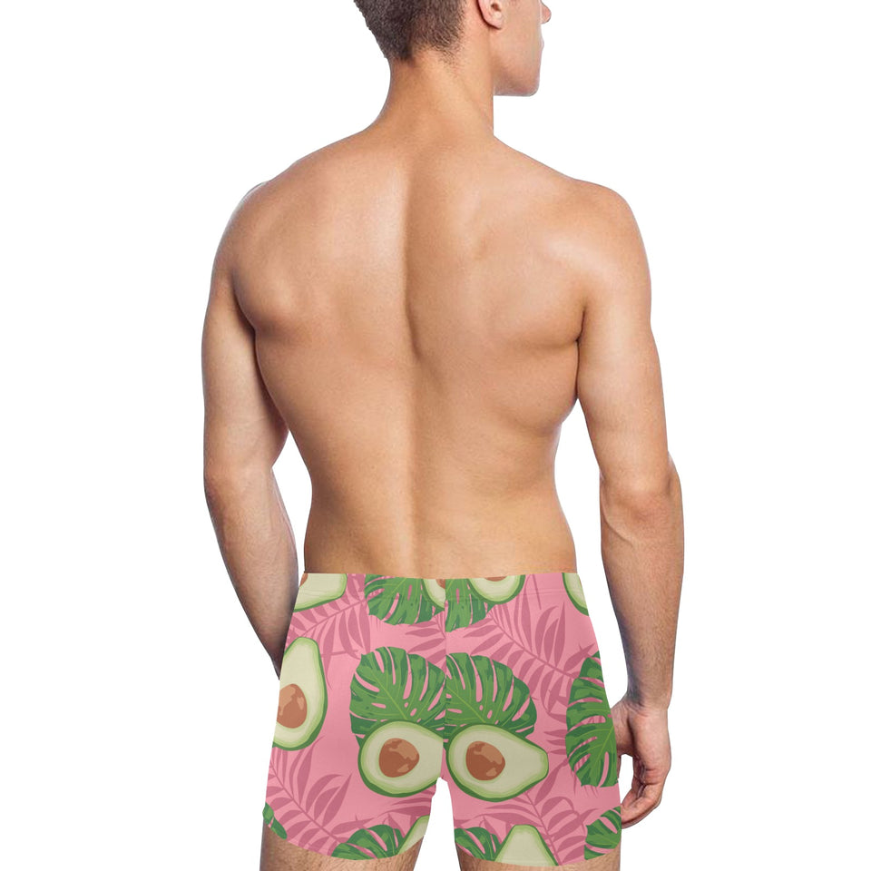 Avocado slices leaves pink back ground Men's Swimming Trunks