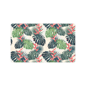 heliconia flowers, palm and monstera leaves Doormat
