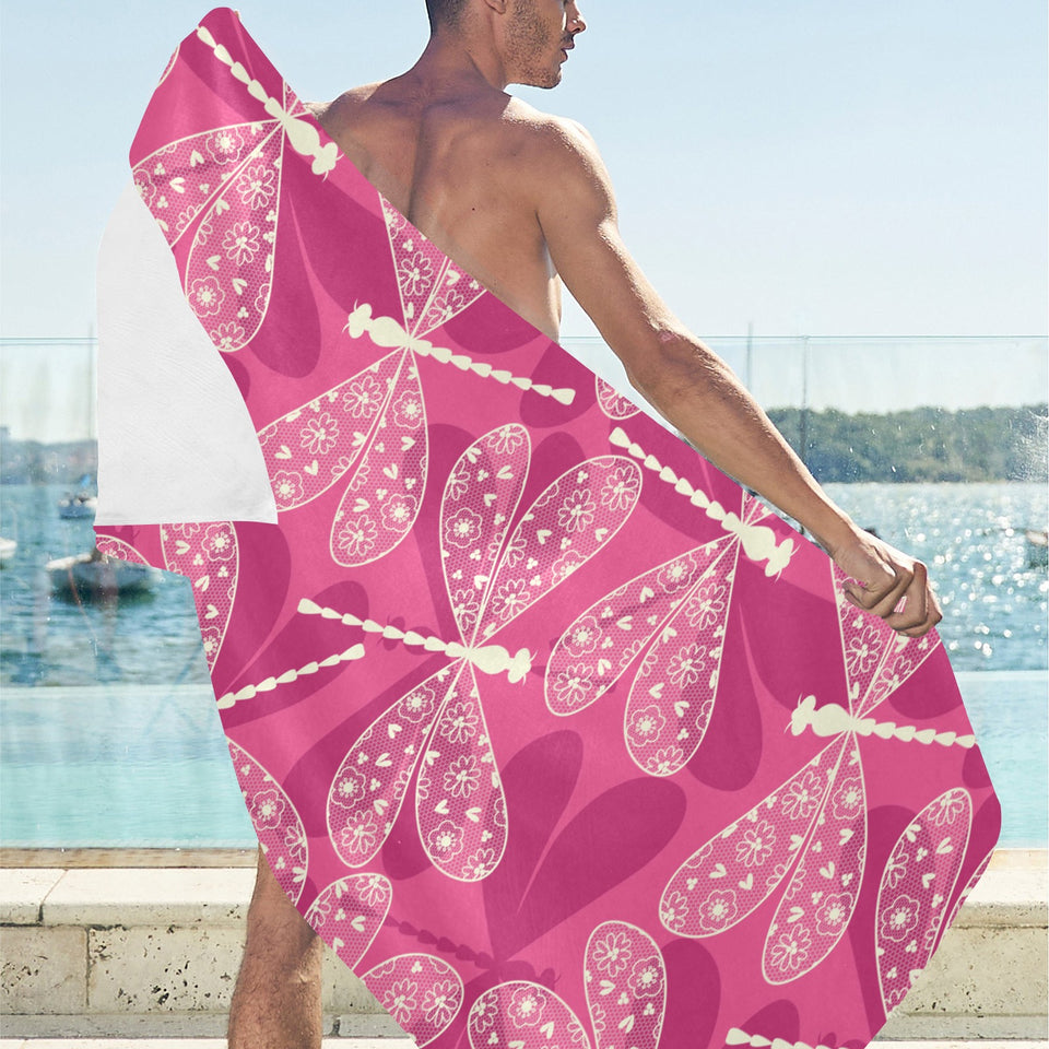 Beautiful dragonfly pink background Beach Towel