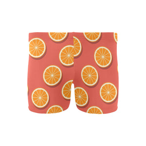 Oranges pattern red background Men's Swimming Trunks