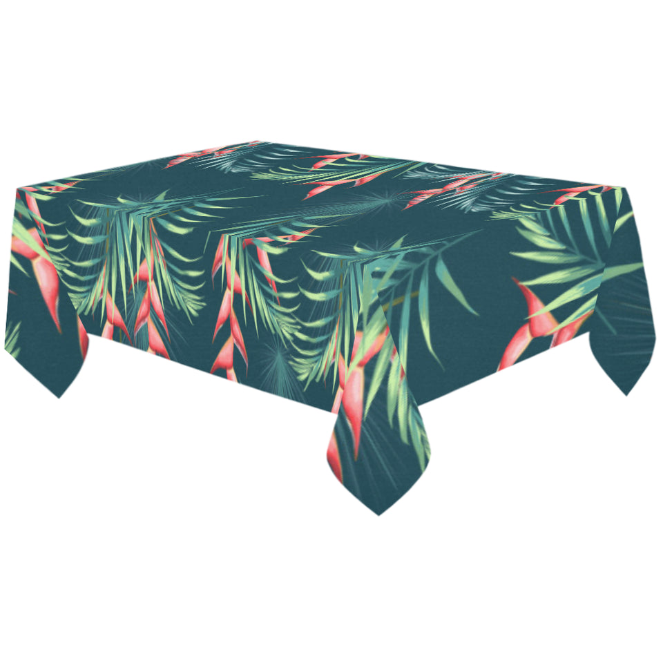 heliconia flowers, palm and monstera leaves on bla Tablecloth