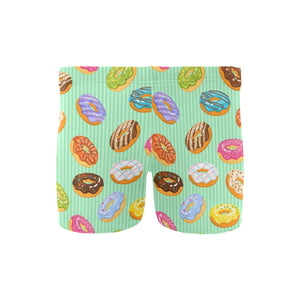 Colorful donut pattern green background Men's Swimming Trunks