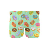 Colorful donut pattern green background Men's Swimming Trunks