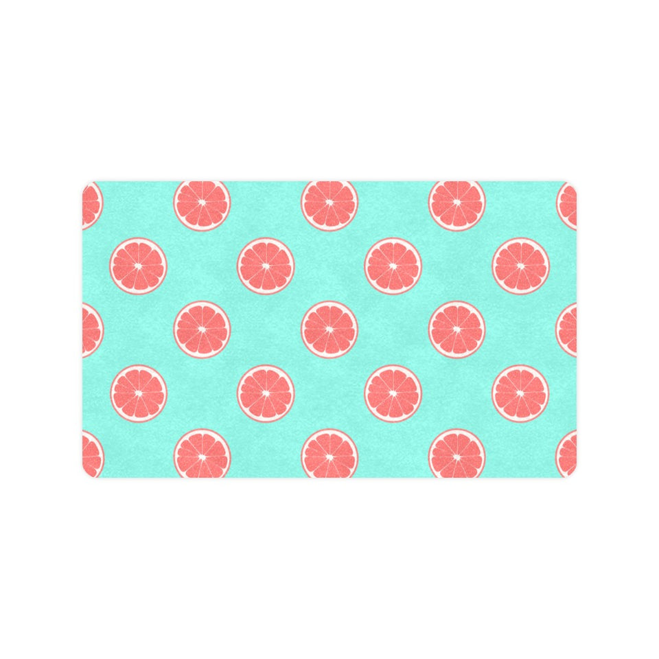 Grapefruit green background Doormat