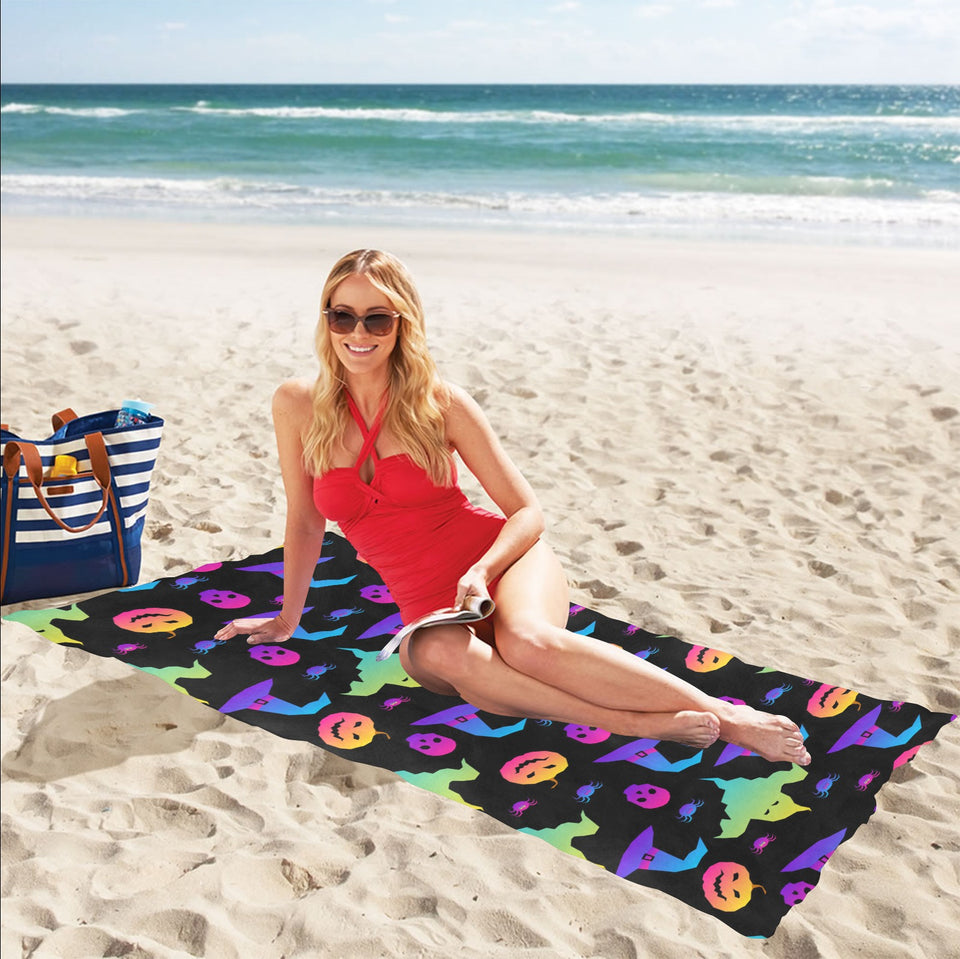 Colorful halloween background Beach Towel