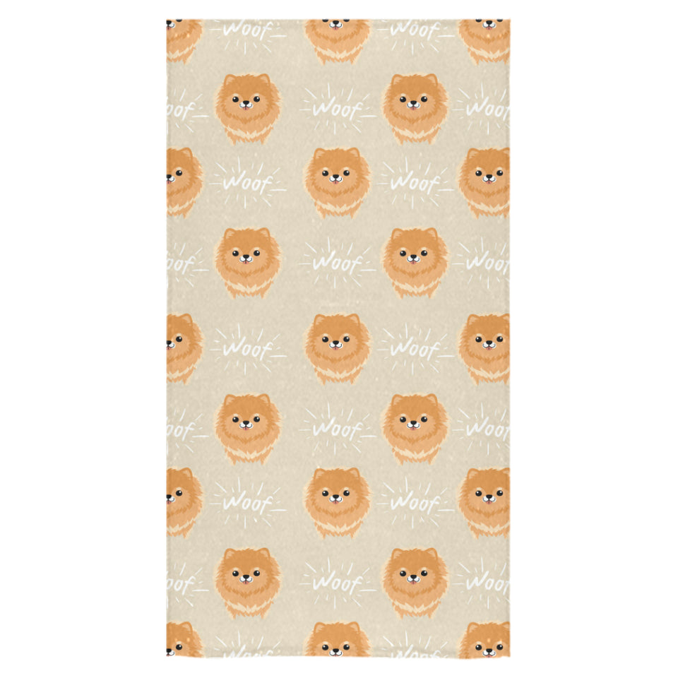 Cute brown pomeranian puppy on blue Bath Towel