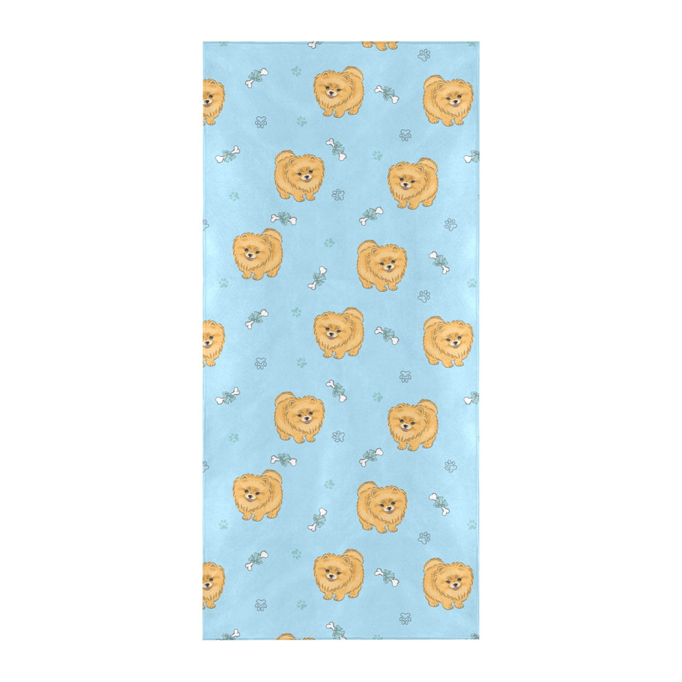 Brown cute pomeranian blue blackground Beach Towel