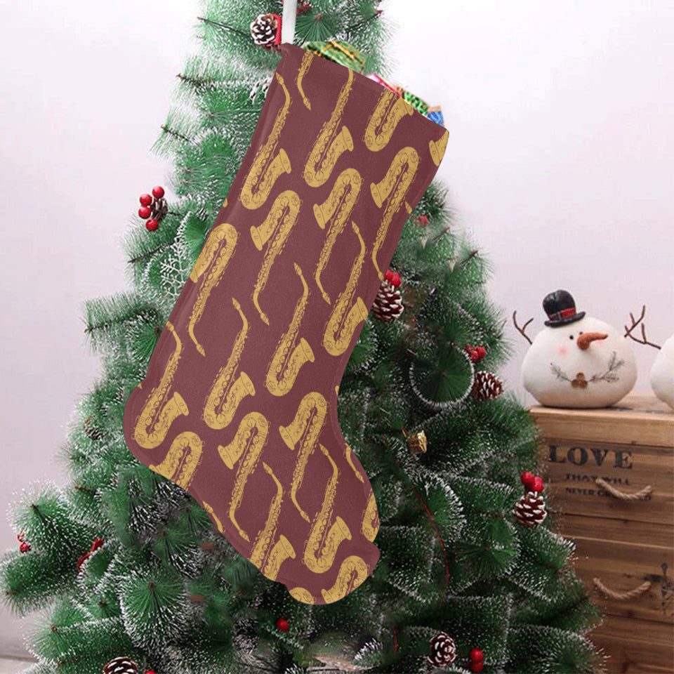 Hand drawn gold saxophone red background Christmas Stocking