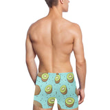 Kiwi blue background Men's Swimming Trunks