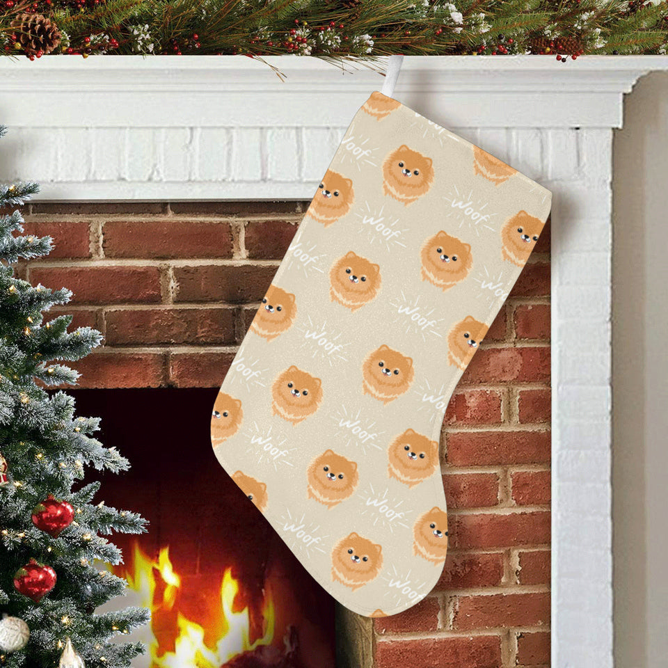 Cute brown pomeranian puppy on blue Christmas Stocking