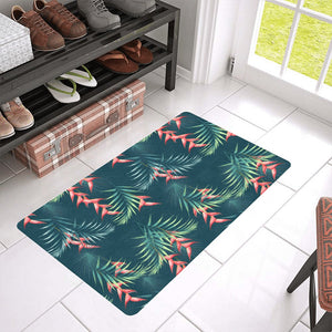 heliconia flowers, palm and monstera leaves on bla Doormat