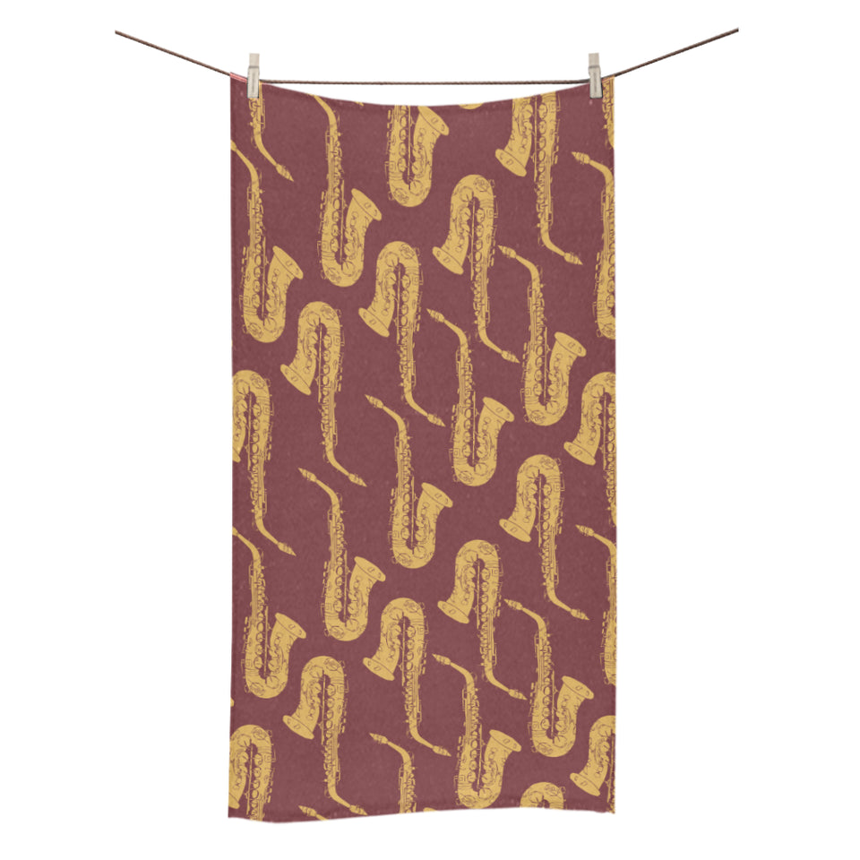 Hand drawn gold saxophone red background Bath Towel