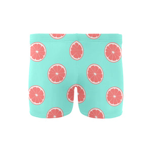 Grapefruit green background Men's Swimming Trunks
