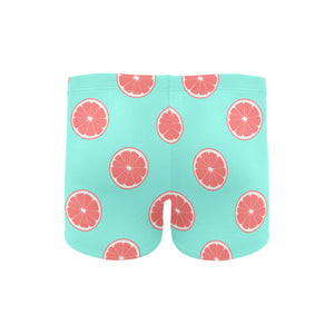 Grapefruit green background Men's Swimming Trunks