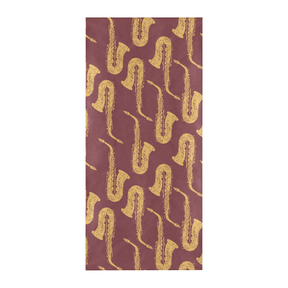 Hand drawn gold saxophone red background Beach Towel