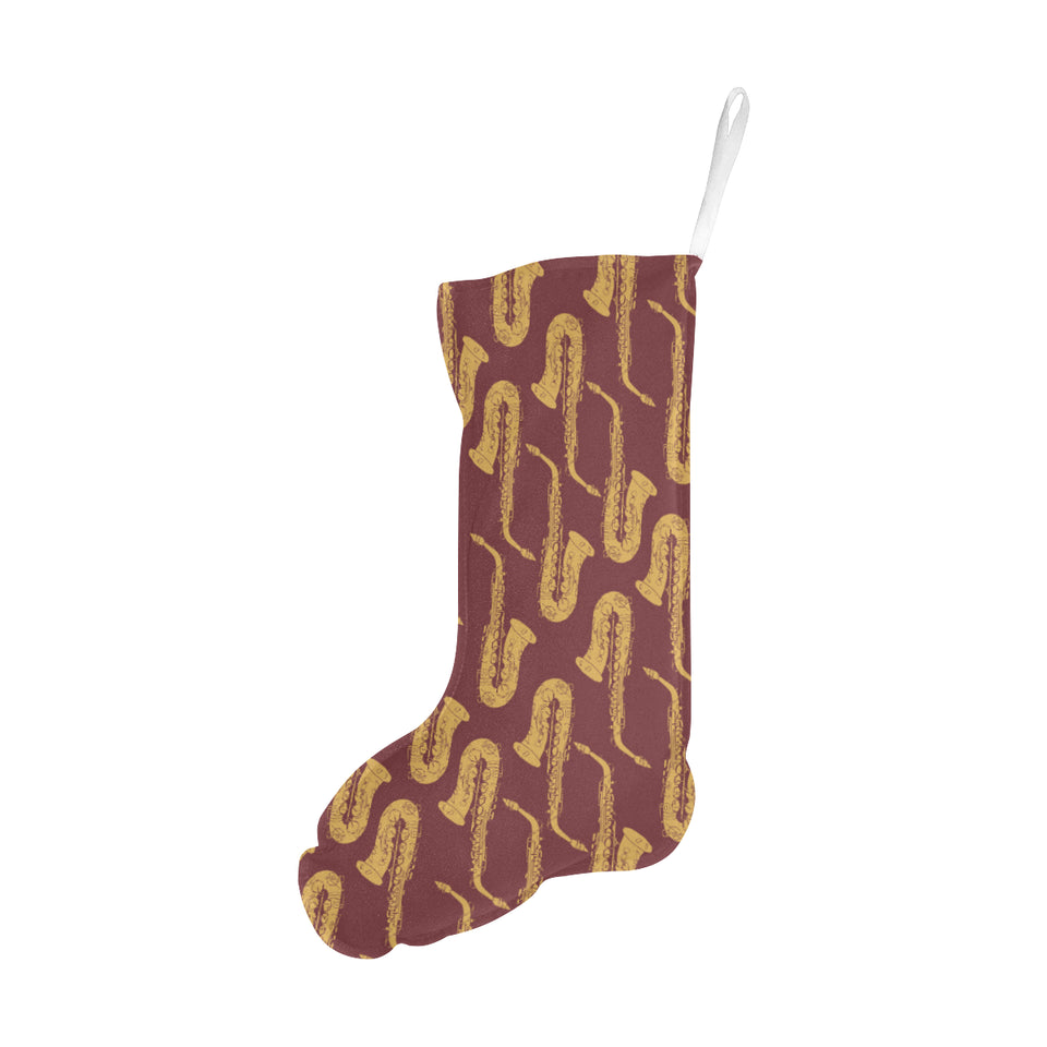 Hand drawn gold saxophone red background Christmas Stocking