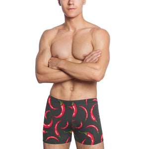 Chili peppers pattern black background Men's Swimming Trunks