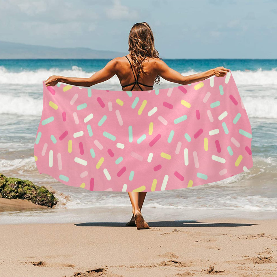 Pink donut glaze candy pattern Beach Towel